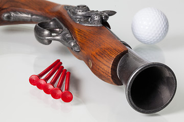 Image showing Old gun and golf equipments