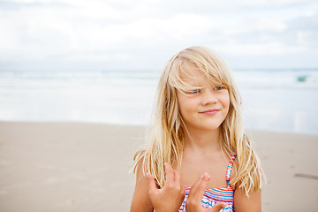 Image showing Happy cute young girl at beach