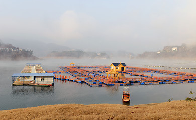 Image showing Landscape of floating house on a lake