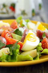 Image showing Salad with anchovies, tomatoes and eggs.