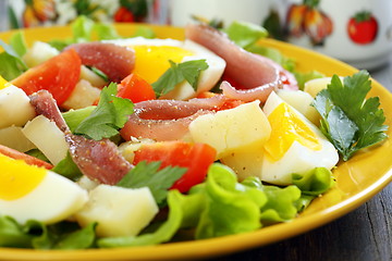 Image showing Colorful salad with anchovies.