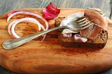 Image showing Fork with anchovies closeup.