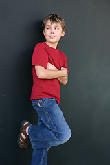 Image showing Boy leaning against wall