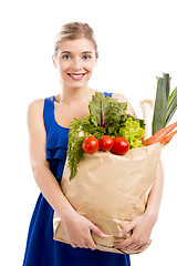 Image showing Beautiful woman carrying vegetables