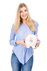 Image showing Beautiful woman holding  a piggy bank