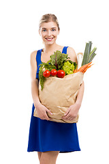 Image showing Beautiful woman carrying vegetables