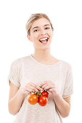 Image showing Beaitiful woman holding red tomatos