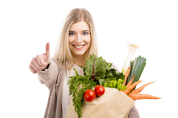 Image showing Beautiful woman carrying vegetables