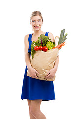 Image showing Beautiful woman carrying vegetables