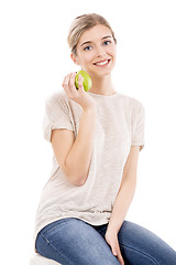 Image showing Beautiful woman with a green apple