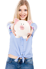 Image showing Beautiful woman holding  a piggy bank