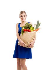 Image showing Beautiful woman carrying vegetables