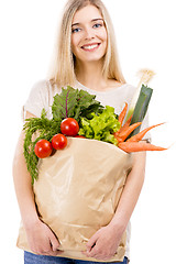 Image showing Beautiful woman carrying vegetables