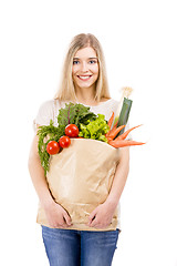 Image showing Beautiful woman carrying vegetables