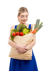 Image showing Beautiful woman carrying vegetables