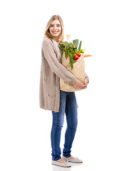 Image showing Beautiful woman carrying vegetables