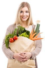 Image showing Beautiful woman carrying vegetables