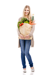 Image showing Beautiful woman carrying vegetables