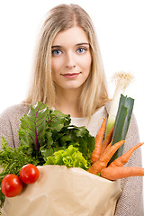 Image showing Beautiful woman carrying vegetables