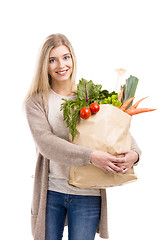 Image showing Beautiful woman carrying vegetables