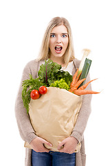 Image showing Beautiful woman carrying vegetables