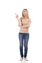Image showing Beautiful woman smiling and pointing