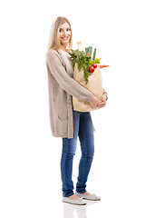 Image showing Beautiful woman carrying vegetables