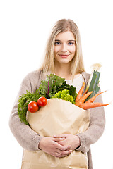 Image showing Beautiful woman carrying vegetables