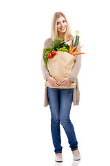 Image showing Beautiful woman carrying vegetables