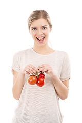 Image showing Beaitiful woman holding red tomatos