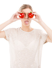 Image showing Beaitiful woman with tomatos in front of the face