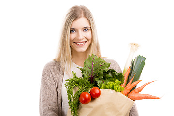 Image showing Beautiful woman carrying vegetables