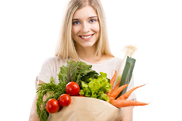 Image showing Beautiful woman carrying vegetables