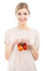 Image showing Beaitiful woman holding red tomatos