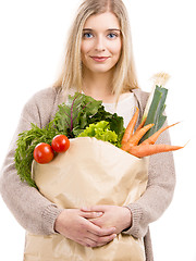 Image showing Beautiful woman carrying vegetables