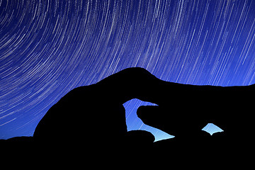 Image showing Night Star Trail Streaks over the Rocks of Joshua Tree Park