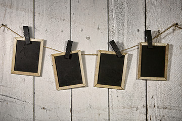 Image showing Film Looking Chalkboards Hanging on a Rope Held By Clothespins