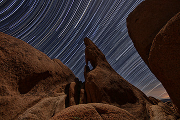 Image showing Night Star Trail Streaks over the Rocks of Joshua Tree Park