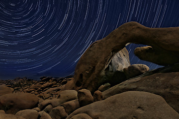 Image showing Night Star Trail Streaks over the Rocks of Joshua Tree Park