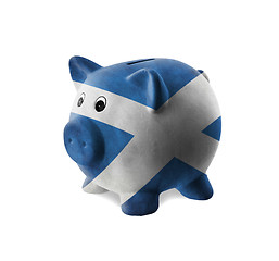 Image showing Ceramic piggy bank with painting of national flag 