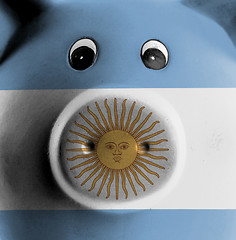 Image showing Ceramic piggy bank with painting of national flag 