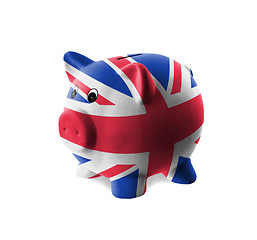 Image showing Ceramic piggy bank with painting of national flag 