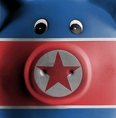 Image showing Ceramic piggy bank with painting of national flag 