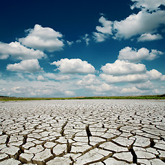 Image showing blue dramatic sky with clouds over desert