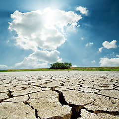 Image showing drought earth and sun in cloudy sky