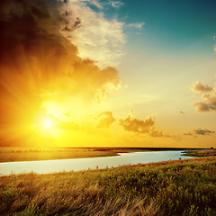 Image showing orange sunset over river