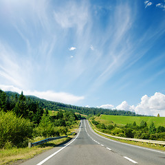 Image showing asphalt road to horizon in mountain and blue sky