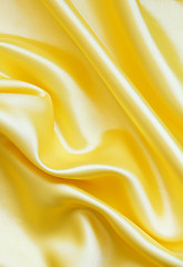 Image showing Smooth elegant golden silk as background 