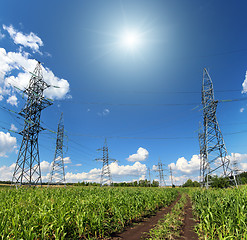 Image showing electric masts and road in green field