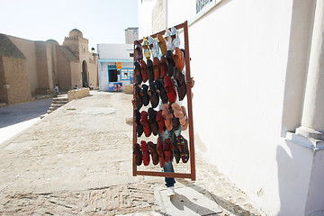 Image showing Muslim man selling shoes